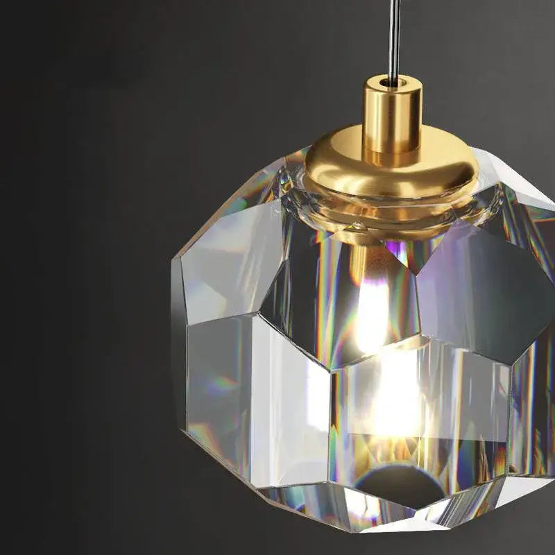 Modern black and gold decorbites crystal round chandelier with faceted crystal pendant and gold-toned metal fixture