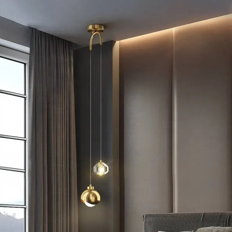 A modern black and gold decorbites crystal round chandelier with gold-toned pendant light and spherical glass shades