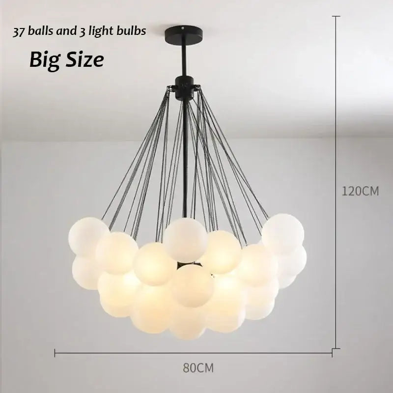 A modern black metal decorbites glass chandelier with 37 frosted orbs for dining room lighting