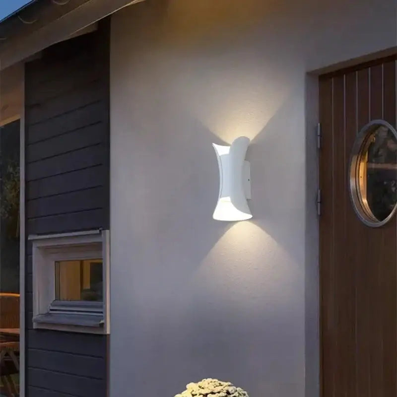 White ceramic wall lamp with sleek curved design from decorbites led waterproof collection for modern living room decor