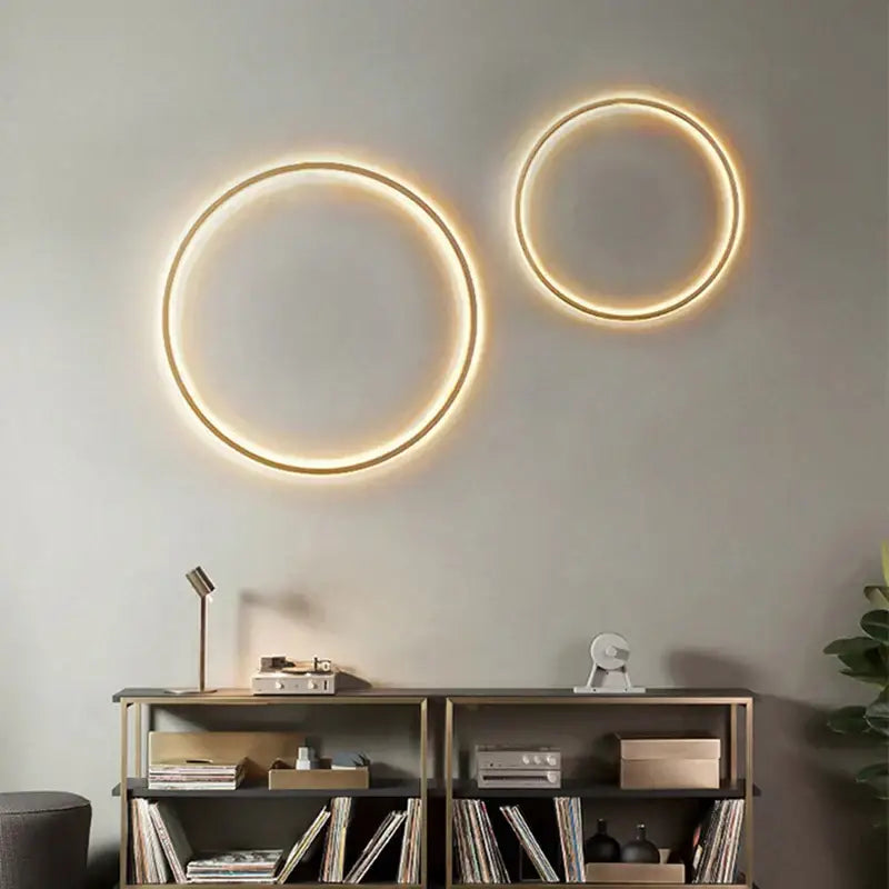 Two modern black and gold dimmable black gold wall lamps with warm glowing ring lights for living room decorbites dimmable black lighting