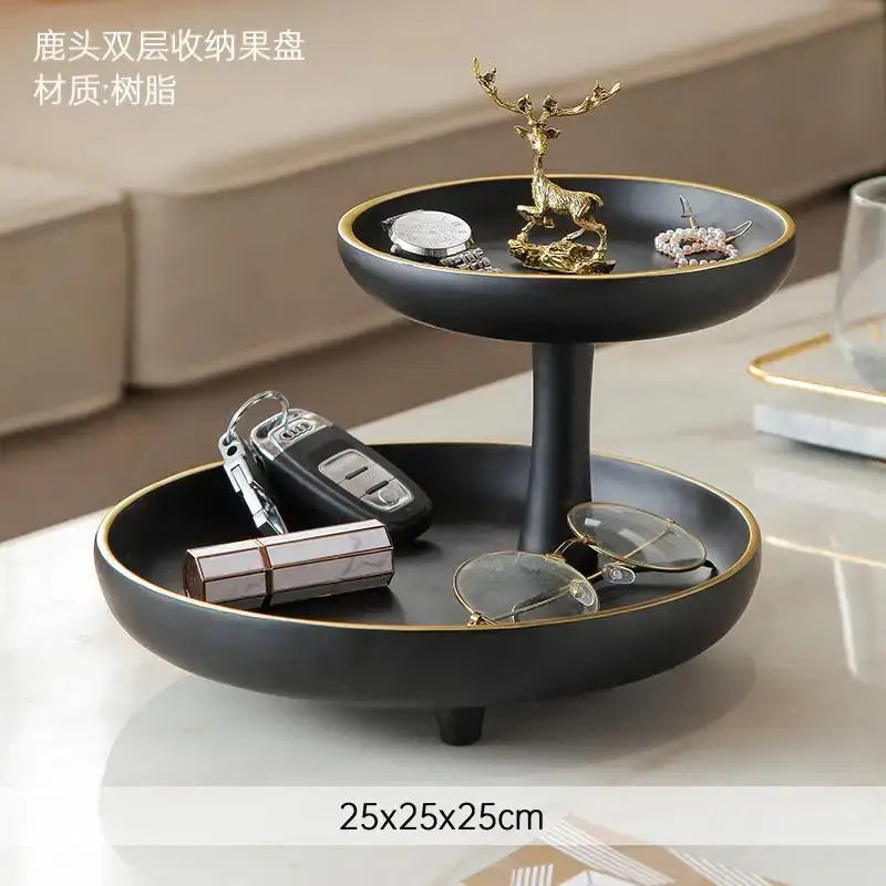 Modern black and gold two-tiered resin coffee table tray with gold rim and deer figurine centerpiece for living room storage