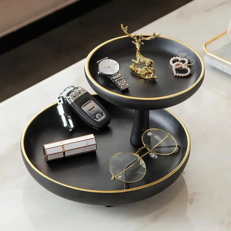Modern black and gold two-tiered coffee table tray with rim accents for stylish living room storage and organization