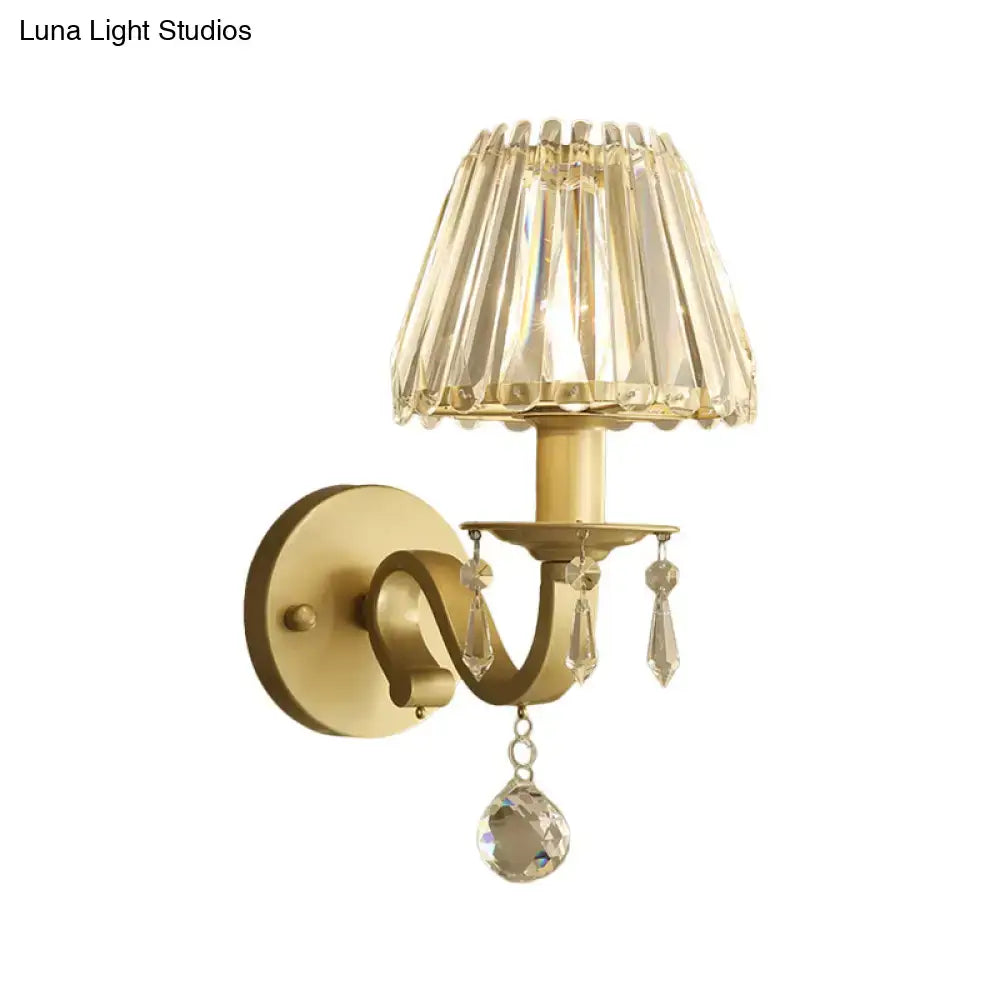 Modern black gold finish wall sconce with fluted crystal shade and dangling teardrop crystals for living room fixture height