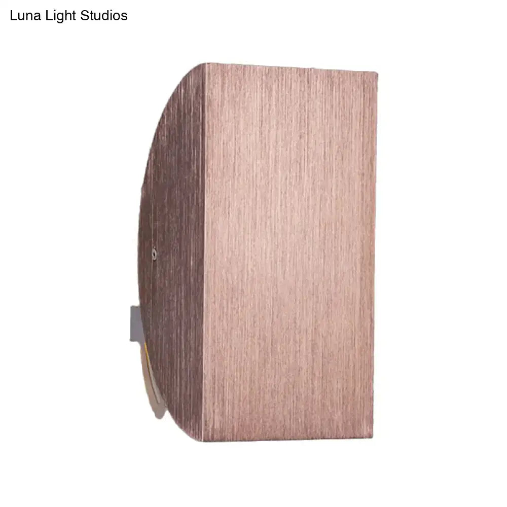 Modern black and gold folded wall light sconce with copper-finished brushed metallic texture for bedroom decor