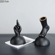 Modern black resin foot statue artwork with gold nail accents designed as elegant living room decor pieces