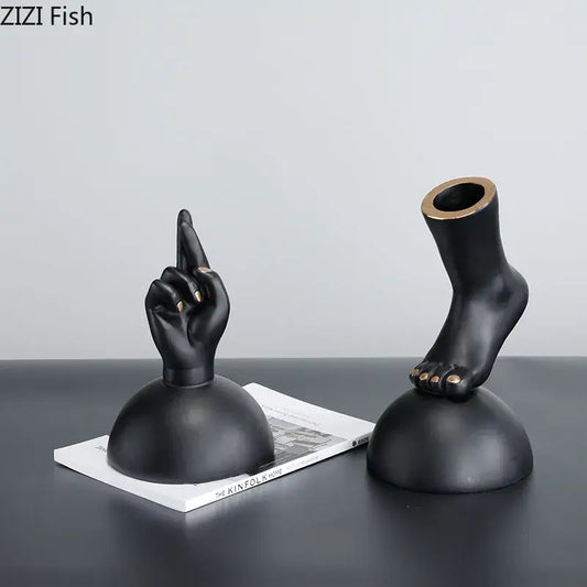Modern black resin foot statue artwork with gold nail accents designed as elegant living room decor pieces