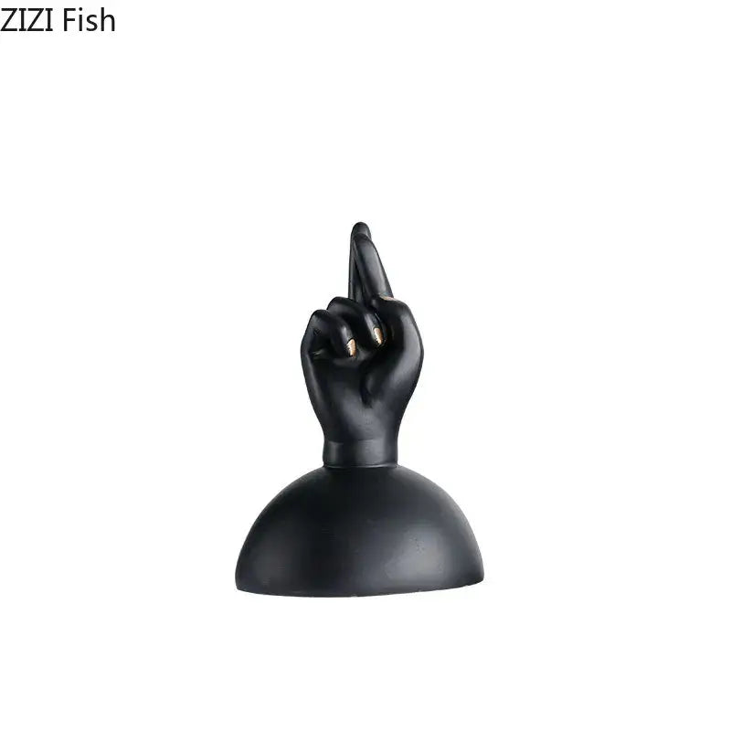 Modern black and gold resin hand sculpture with crossed fingers and gold-tipped nails as foot statue artwork decor