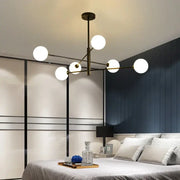 Modern black and gold g9 led chandelier with six white glass globes and brass finish for living room decorbites black gold