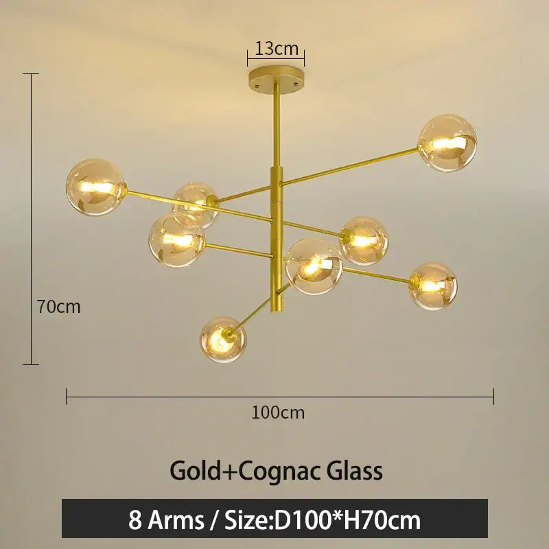 Gold g9 led chandelier with eight arms and cognac glass globes in decorbites black gold finish for living room decor
