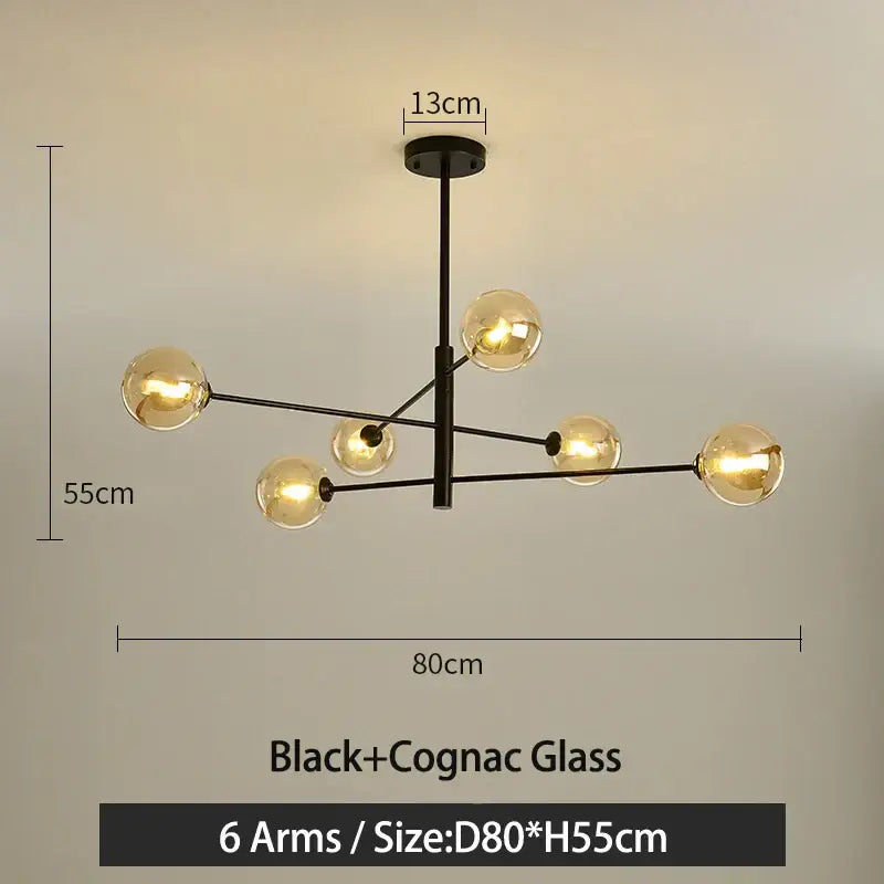 Modern black metal led chandelier with six arms and warm cognac glass globes by decorbites black gold g9 led design