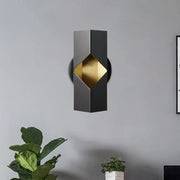 Modern black and gold geometric led sconce with iron shade and sleek 12 inch fixture for bedroom lighting