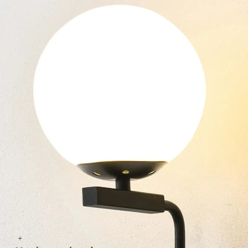 Modern black metal floor lamp with large opaque white spherical glass globe for wall lamp decorbites glass ball led use