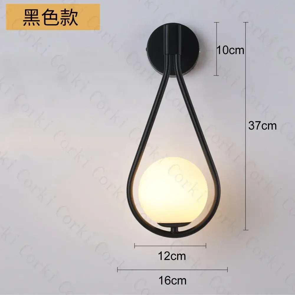 Modern black metal wall lamp with teardrop frame and warm glass ball led bulb for bedroom decorbites glass ball sconce