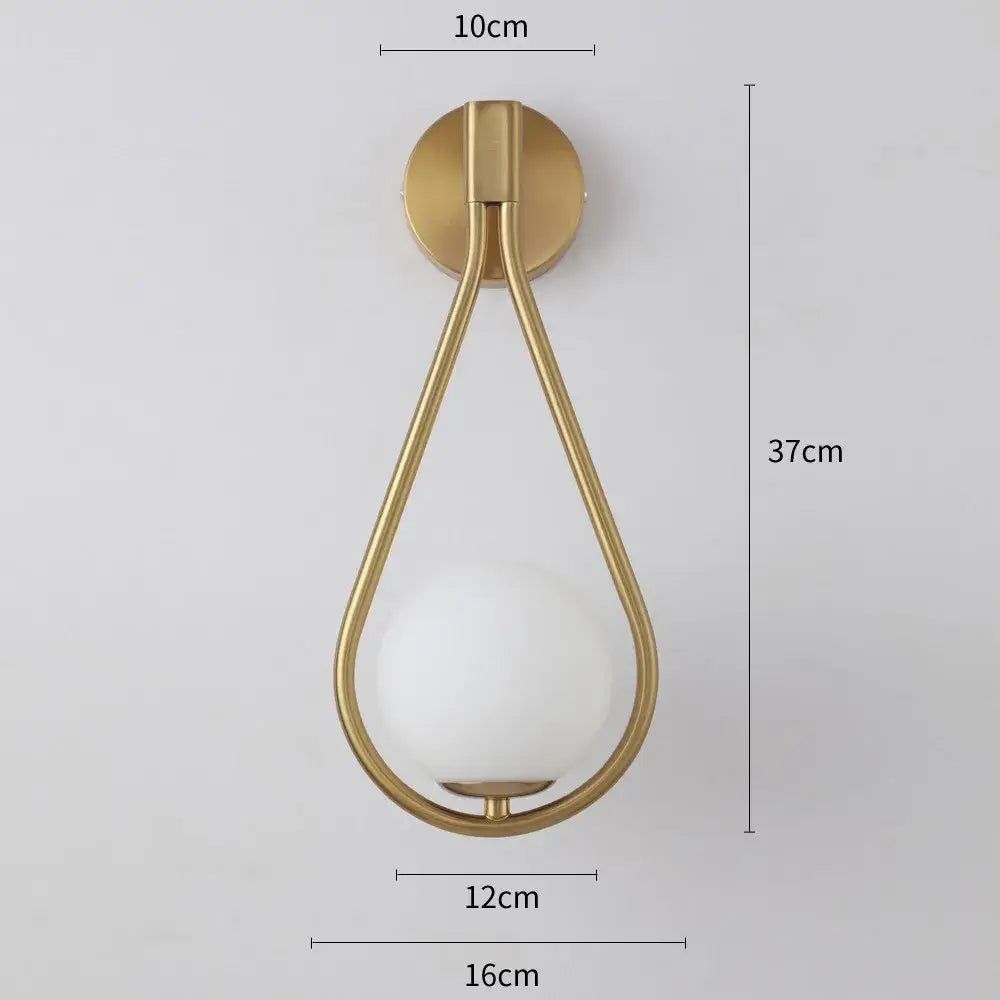 Gold-toned teardrop-shaped wall lamp with frosted glass globe decorbites glass ball led bedroom sconce