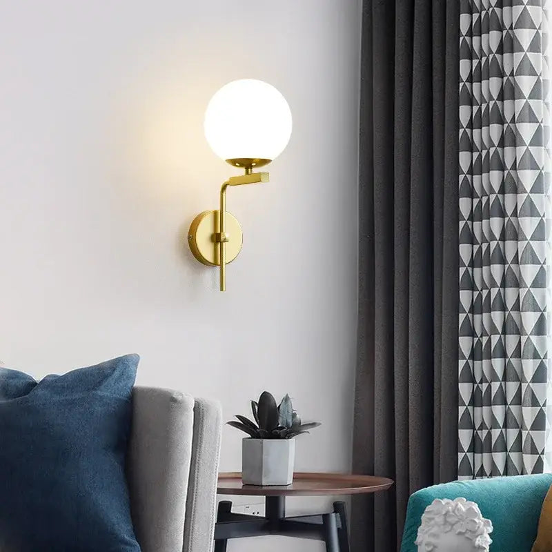 Modern black and gold glass ball led wall lamp with gold-toned sconce and frosted glass globe for bedroom decorbites wall lamp