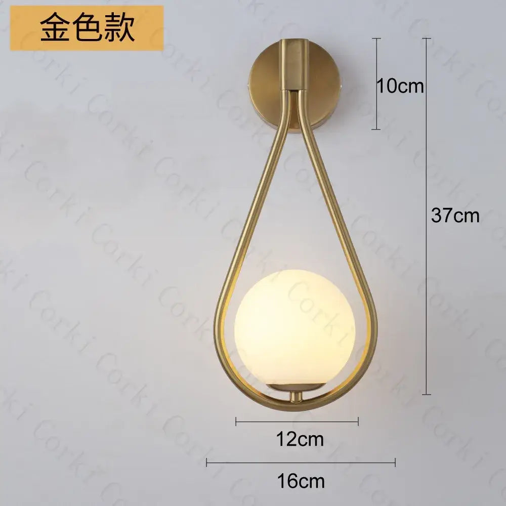 Modern black and gold wall lamp featuring a gold-toned teardrop sconce with a frosted glass ball led decorbites glass ball design