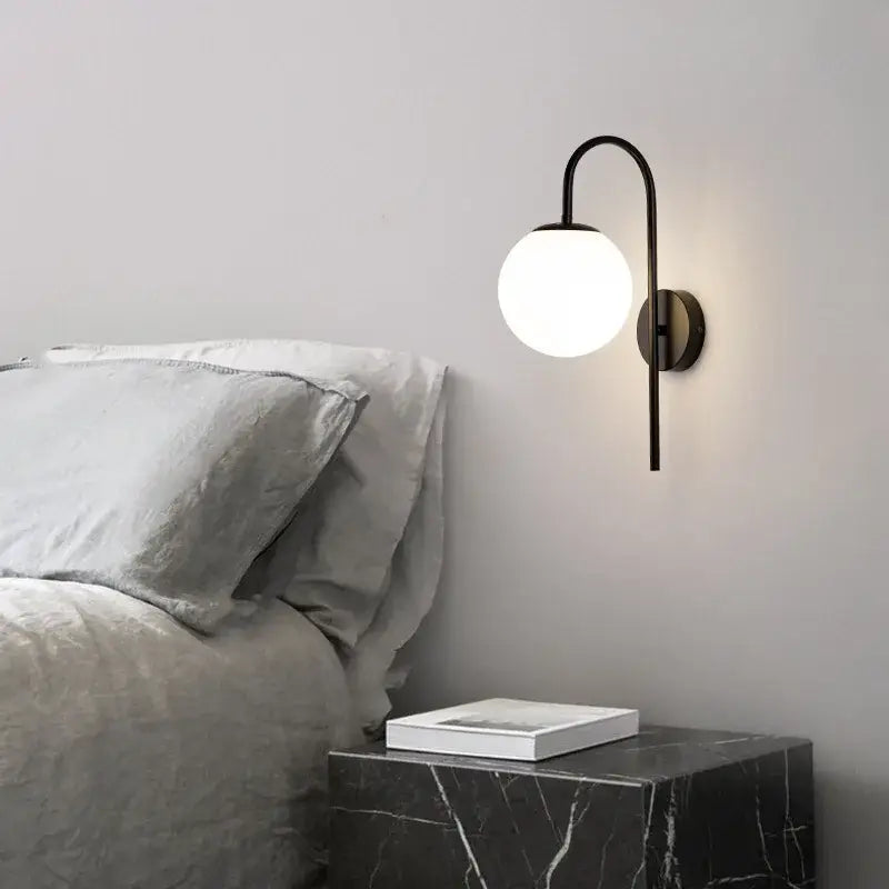 Modern black curved wall sconce with frosted glass globe for bedroom decorbites glass ball led wall lighting