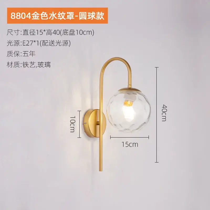 Modern black and gold glass ball led wall light with faceted glass globe and curved metal arm for bedroom decorbites glass ball