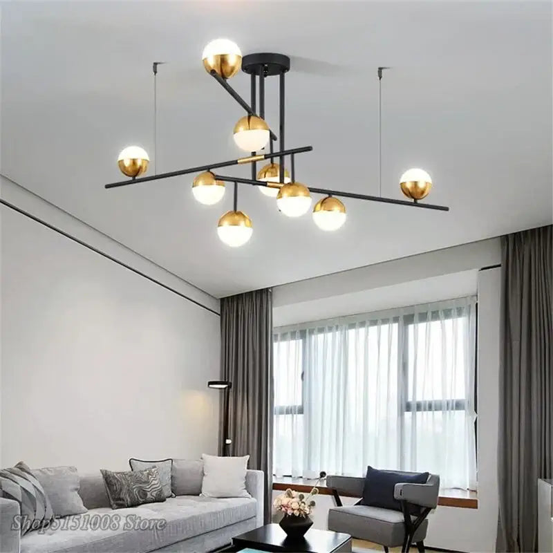Modern black and gold glass ball pendant lamp with geometric branch-like design for dining room decorbites fixture