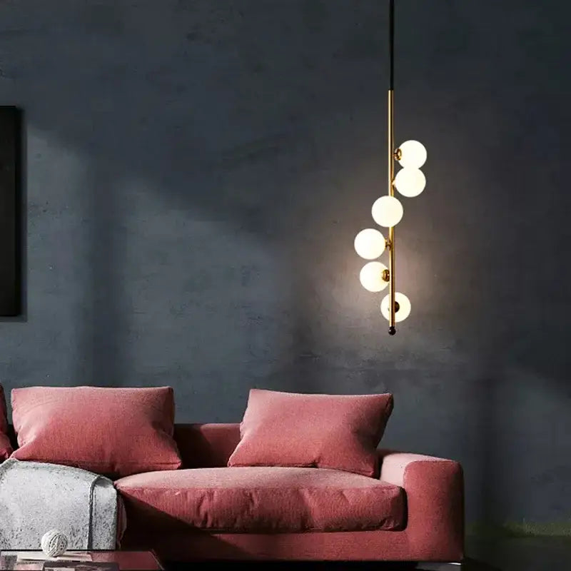 Modern black and gold glass ball pendant lights with slender metal frame and five frosted globe bulbs for dining room decorbites glass ball pendant