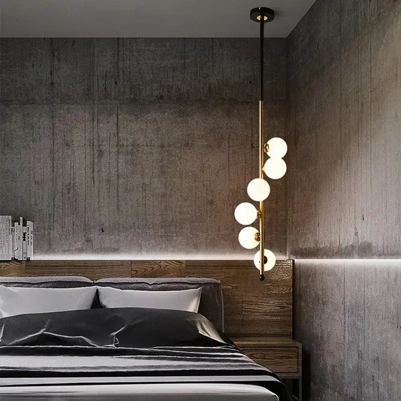 Modern black and gold glass ball pendant lights with five gold-toned spherical white glass bulbs for dining room decorbites glass ball pendant