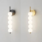 Modern black and gold wall lamp with five frosted glass spheres for decorbites glass bedside led bedroom sconce
