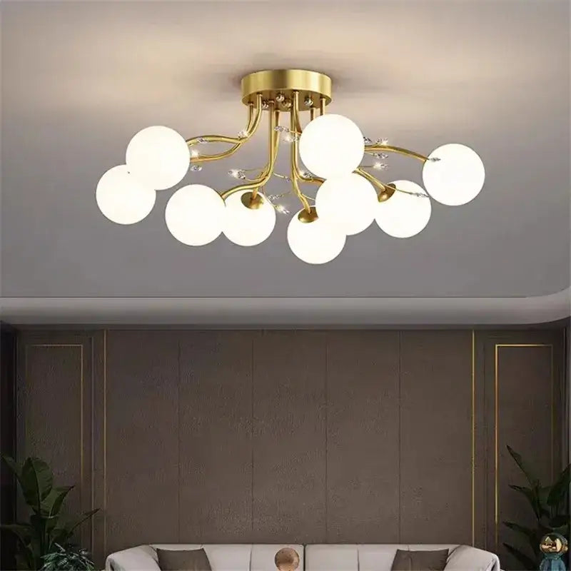 Gold-toned decorbites glass bubble ceiling light with frosted glass globes and crystal accents for modern living room decor