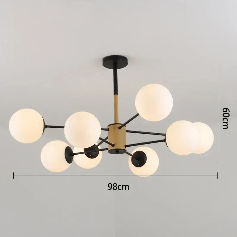 Modern black gold glass pendant light with brass hub and eight frosted globes for living room decorbites black gold