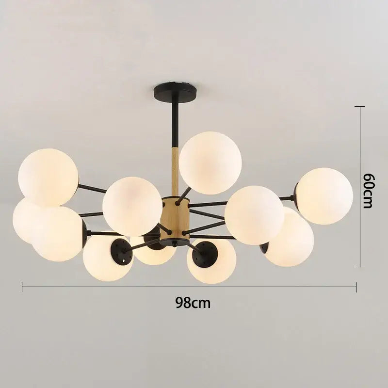 Modern black gold glass pendant light with frosted white globe shades and brass black arms for living room decorbites black gold