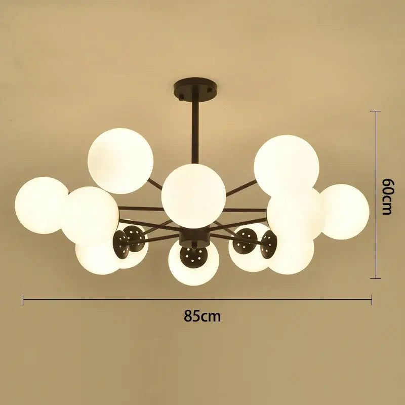 Modern black gold glass pendant light with multiple frosted white spherical globes for living room decorbites black gold