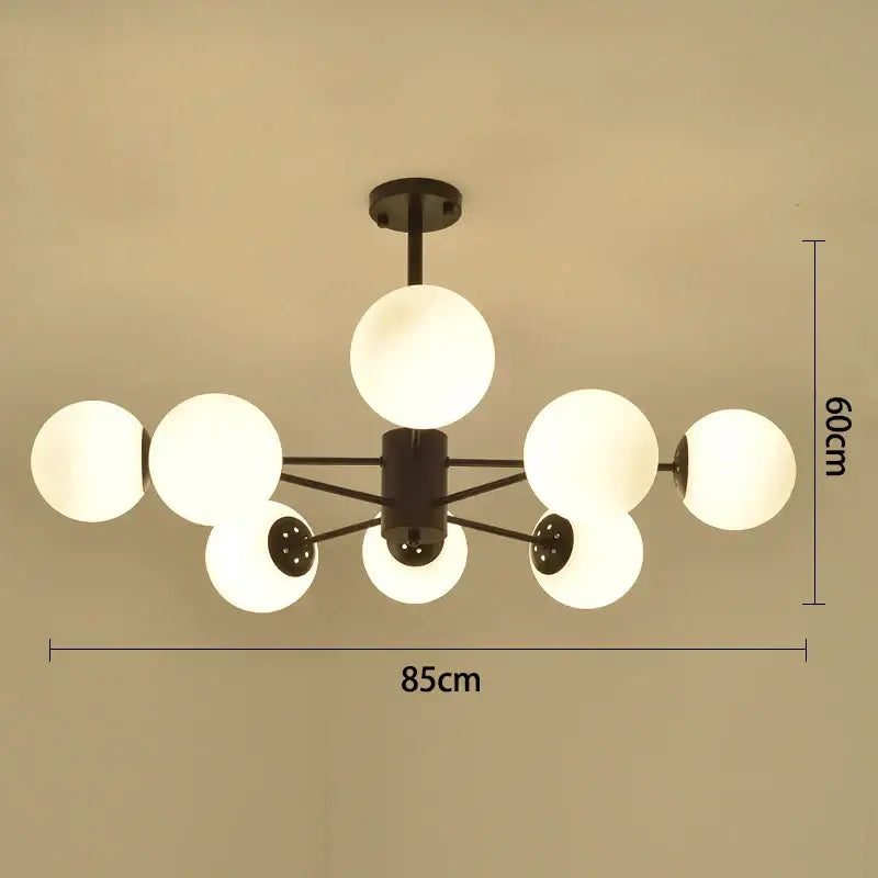 Modern black gold glass pendant light with six frosted globe shades for elegant living room decorbites black gold lighting