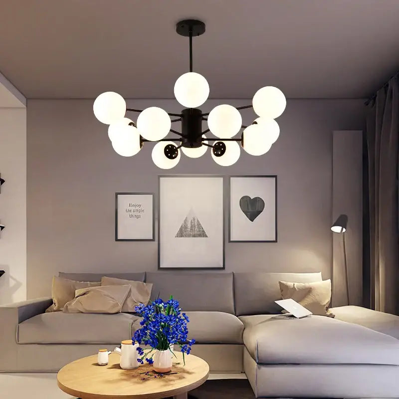 Modern black gold glass pendant light with multiple frosted globe bulbs for living room decorbites black gold style