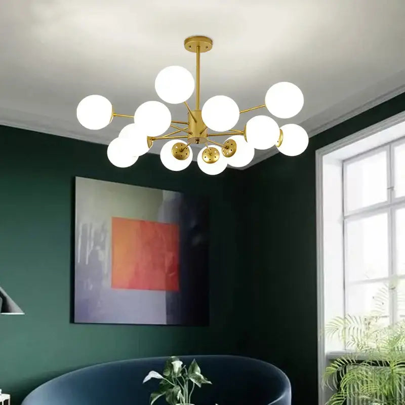 Modern black gold glass pendant light with gold-toned frame and frosted glass globes for living room decorbites black gold