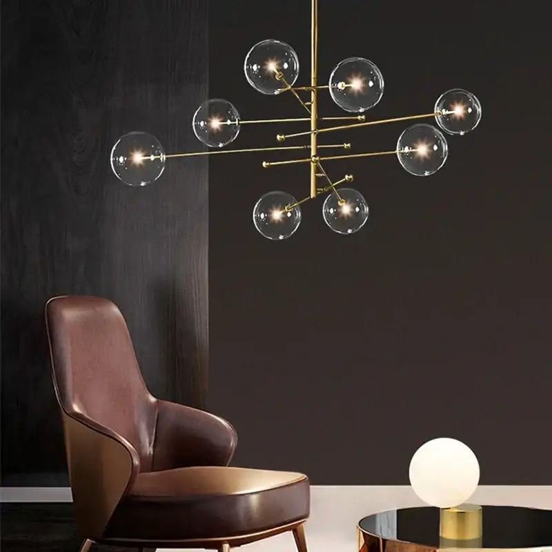 Modern black gold glass led chandelier featuring gold-toned metal and clear glass globe bulbs for living room decorbites black gold