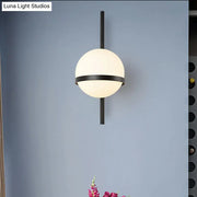Modern black and gold wall sconce with frosted glass shade and spherical design for bedroom e26 e27 light type