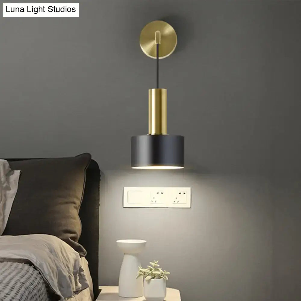 Modern black and gold grenade shaped wall lamp with brass stem and matte black shade for bedroom reading light
