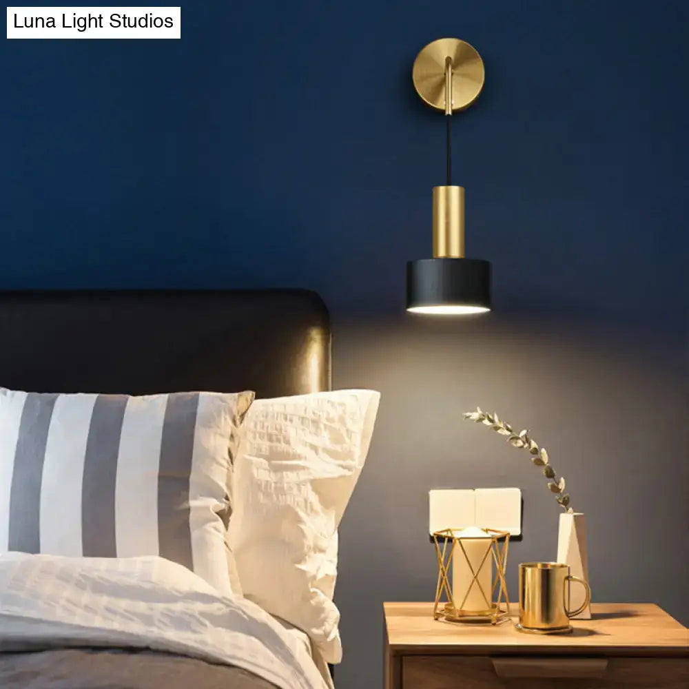 Modern black and gold grenade shaped wall lamp with cylindrical design for bedroom reading light