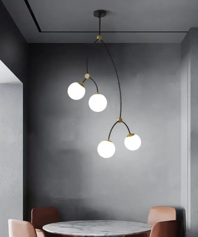 Modern black and gold island light with four milk white clear ball glass shade bulbs for dining room lighting