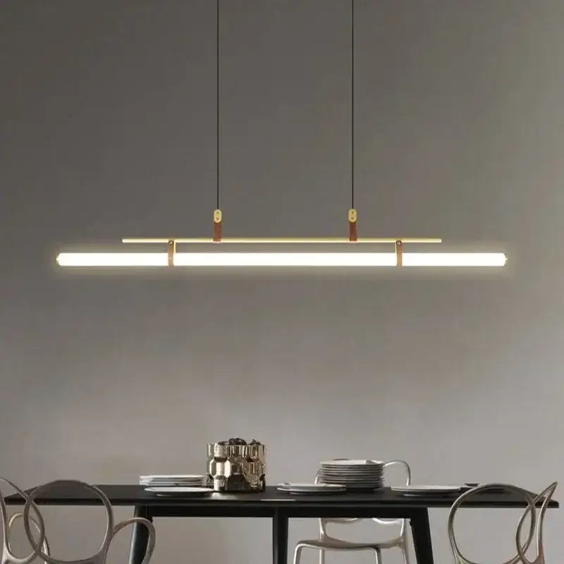 Modern black gold leather tube led pendant light with sleek rectangular design and warm white illumination for dining room