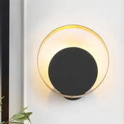 Modern black and gold led bedroom sconce with pull chain featuring a 12 inch fixture and warm ambient light
