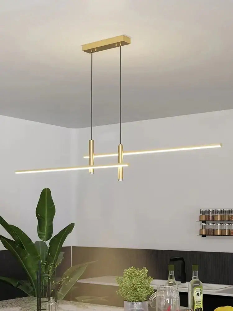 Modern black and gold led chandelier with gold-toned linear pendant light and sleek cylindrical fixtures for dining decorbites black gold