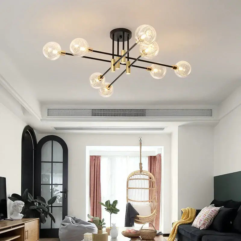 Modern black and gold led chandelier with multiple clear glass globe bulbs for living room decorbites black design