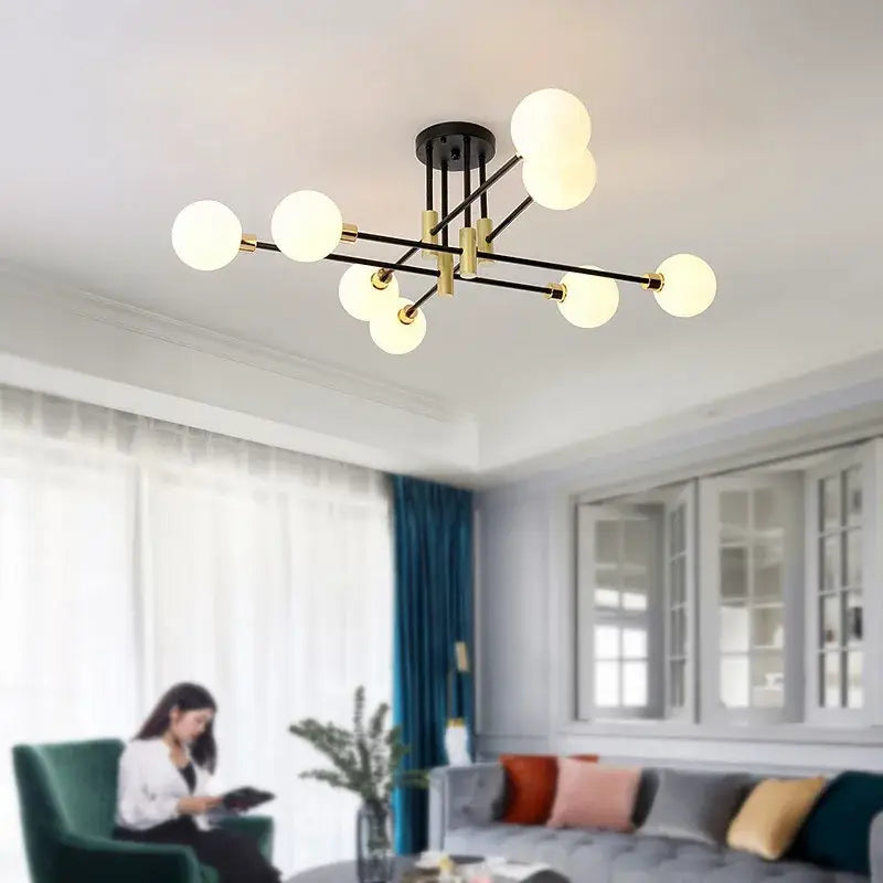 Modern black and gold led chandelier with spherical frosted glass bulbs perfect for living room decorbites black gold led lamp