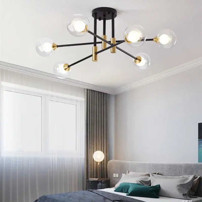 Modern black and gold led chandelier featuring clear glass globe bulbs for elegant living room decorbites black design