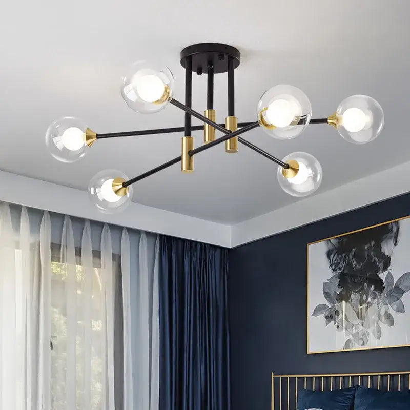 Modern black and gold led chandelier with clear glass globe bulbs for living room decor by decorbites black gold led