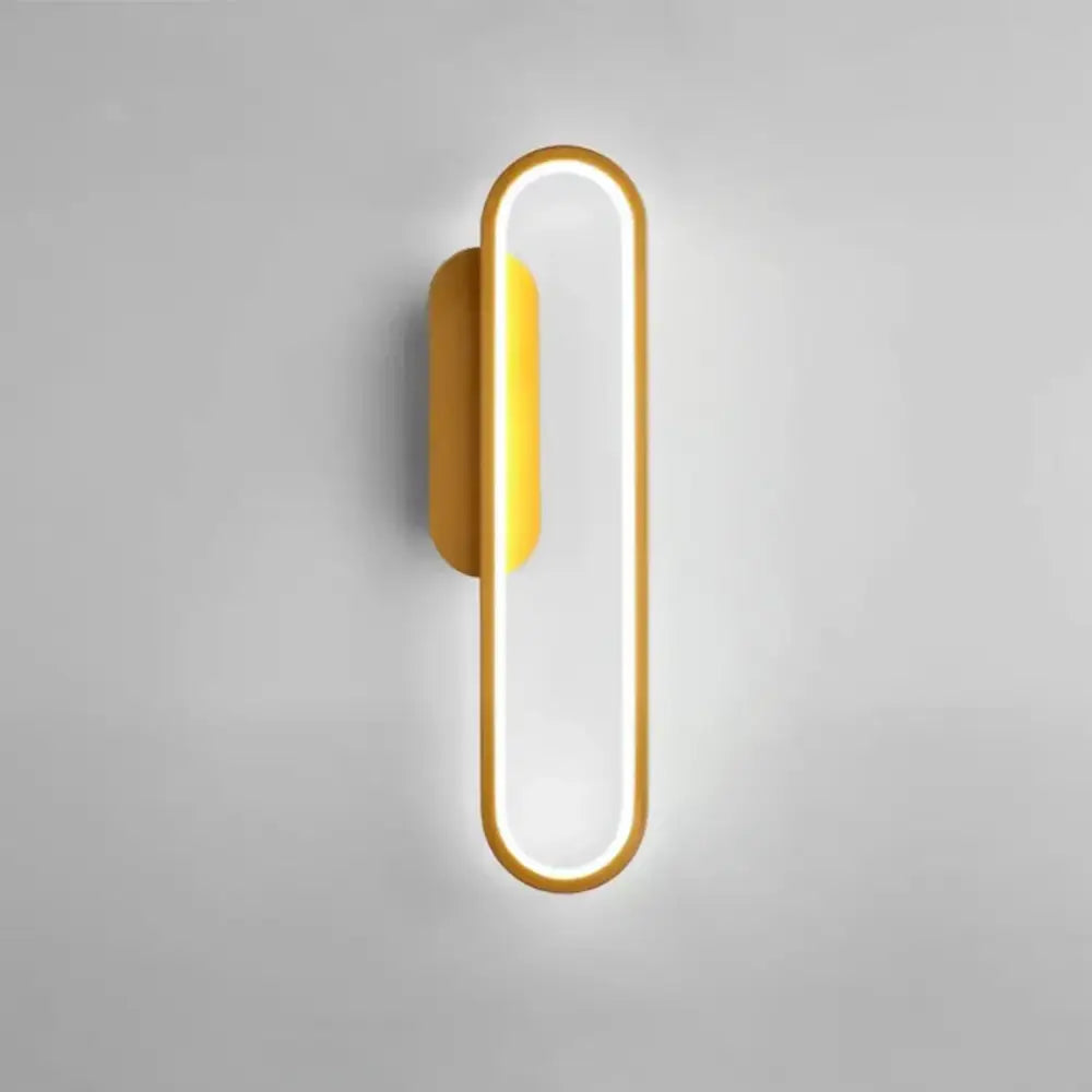Modern black and gold led indoor wall light with a gold-toned frame and warm ambient lighting by decorbites black