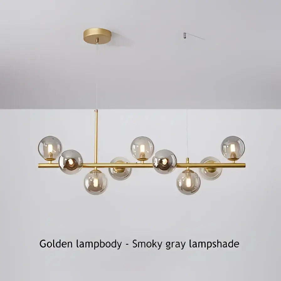 Modern black and gold led pendant chandelier with smoky gray glass globe shades for living room lighting