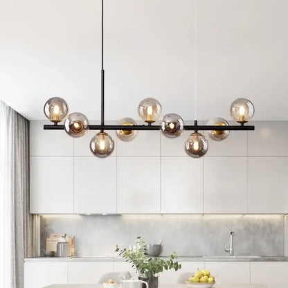 Modern black led pendant chandelier with amber glass globe bulbs in black and gold for living room lighting