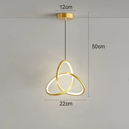 Modern black and gold led pendant light featuring three interlocking gold rings with a sleek minimalist design